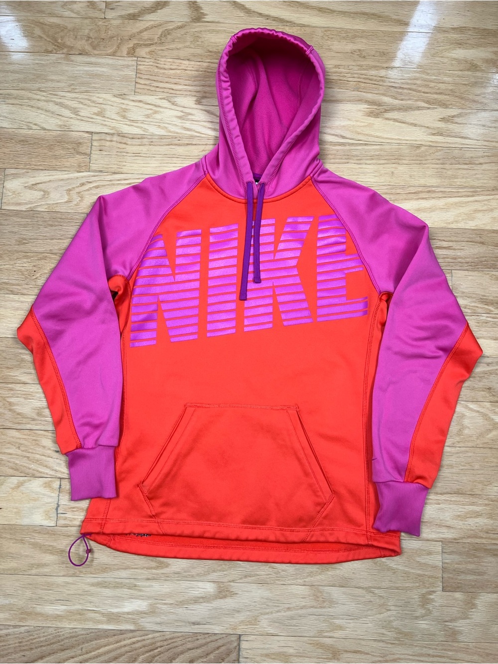 Nike Women’s Therma-FIT Colorblock Pullover Hoodie in Bright Orange & Purple